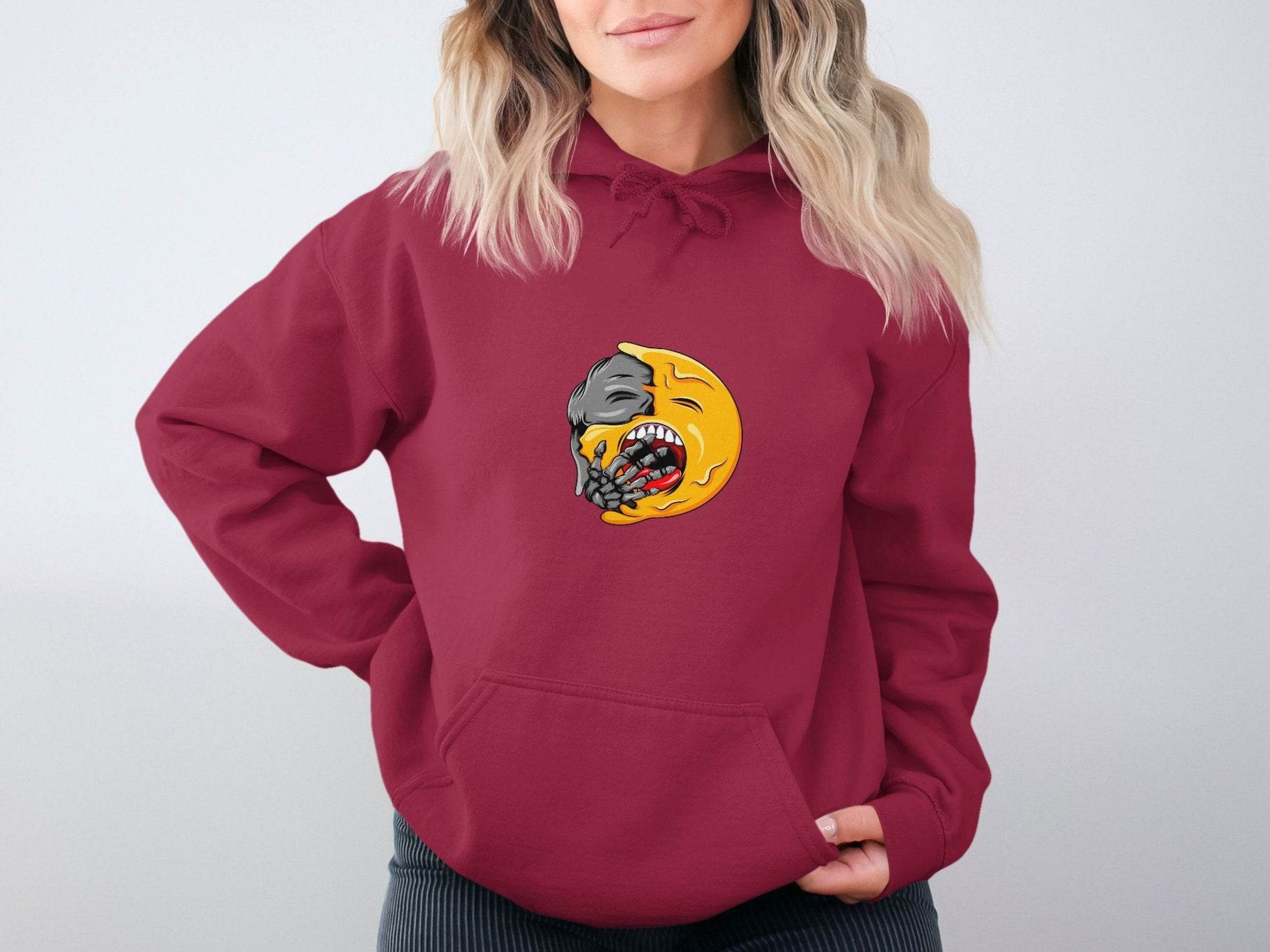 Zombie Emoji Biting Skeleton Hand Illustration Hoodie - Design & Vybe