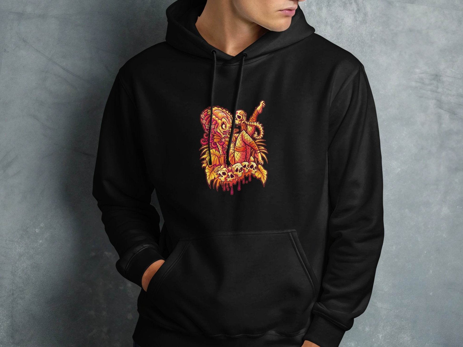 Predator Resting Atop Skulls Graphic Hoodie - Design & Vybe